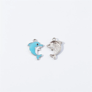 Detail of blue enamel and silver dolphin charms for DIY jewelry making and bracelets