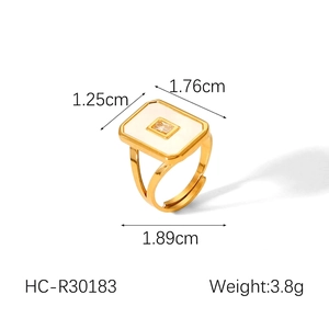Detailed view of adjustable 18k gold plated ring with square zircon and white shell inlay