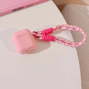 Pink silicone AirPods case featuring a durable pink and white braided lanyard detail