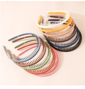 Detail of multi-color matte plastic headbands with non-slip teeth and woven texture