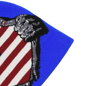 Close-up of US flag pattern on blue knit beanie showing high-density woven texture