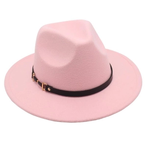 Detail of pink wool fedora hat featuring black leather band and golden metal buckle