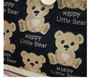 Close-up of Happy Little Bear canvas lunch bag showing coarse woven fabric texture