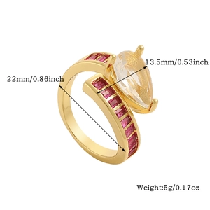 Detail view of gold ring with red pear-cut stone and precise dimension markings