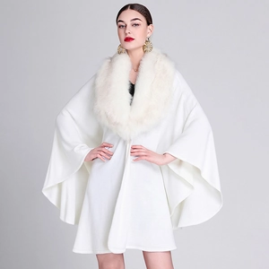 Elegant white knitted poncho cape for women featuring a plush faux fox fur collar