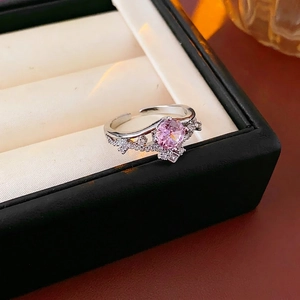 Elegant silver open crown ring featuring a sparkling pink zircon and pave accents