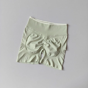 Detailed view of seamless mint green yoga shorts with high waist and scrunch butt design