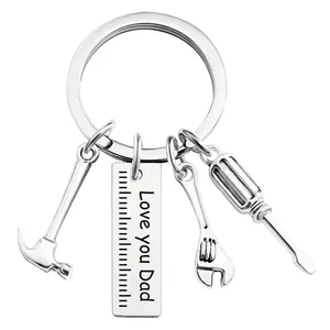 Detail of Dad's tool keychain with mini hammer, wrench, and Love you Dad engraving