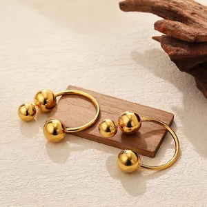 Minimalist gold ball drop earrings with asymmetric metal spheres for women