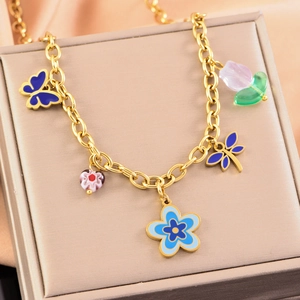 Golden pastoral style chain necklace with blue flowers and colorful butterfly charms
