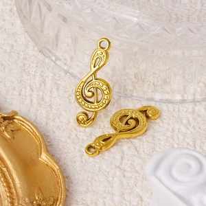 Golden music note pendants in 304 stainless steel on a professional aesthetic background