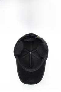 Detail of winter wool baseball cap featuring fold-down ear flaps and metal back strap