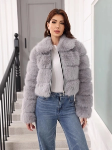 Short faux fur grey jacket with long sleeves paired with casual blue straight-leg jeans