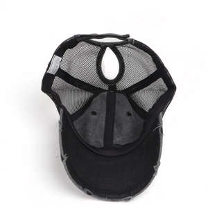 Detail of ponytail hole and mesh back on distressed washed cotton baseball cap