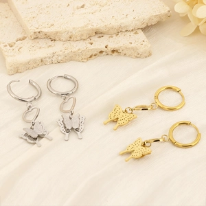 Chic 18K gold and silver plated butterfly heart drop earrings on stone background