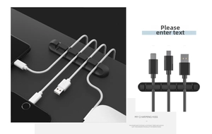 Detailed view of black 5-slot silicone cable organizer with adhesive backing for desk