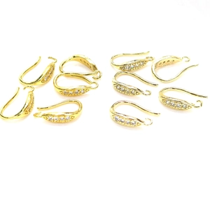 Macro detail of 14K gold plated earring hooks with white zircon inlay for DIY jewelry