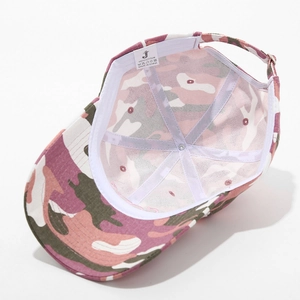 Detail view of pink camouflage cotton baseball cap showing internal label and adjustable strap