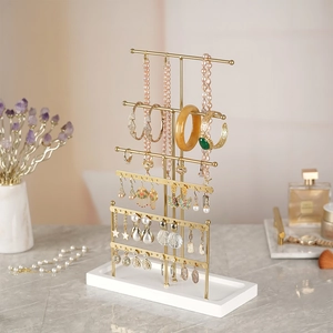 Golden 6-tier metal jewelry stand for necklaces and earrings with white base