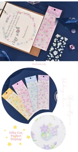 Close-up of decorative floral PET stickers in multiple colors for scrapbooking and DIY