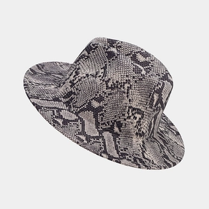 Detail of elegant wool fedora hat featuring a grey snakeskin pattern and wide brim