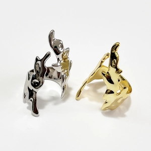 Artistic fluid lava rings in polished silver and gold finishes with modern wavy design