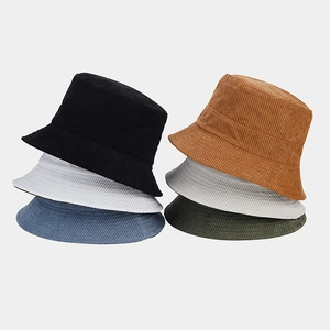 Detail showing various colors of corduroy bucket hats with soft velvet texture