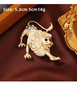 Macro shot of a vintage gold lion brooch with rhinestones measuring 5.3cm by 5cm