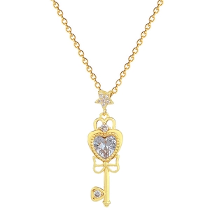 Elegant gold bow-tie key necklace with sparkling heart-shaped zircon on white background