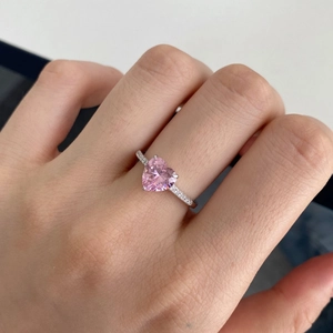 Close-up of S925 silver ring featuring heart-shaped pink zircon and micro-set diamonds