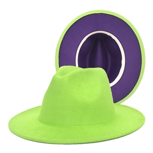 Detail view of two-tone wool felt fedora with neon green crown and purple inner brim