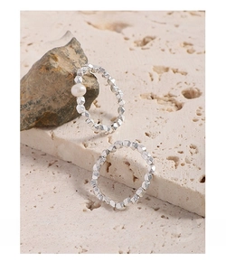 Close-up detail of S925 sterling silver textured crushed silver ring with pearl