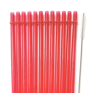 Set of 12 red glitter reusable straws with cleaning brush on a white background