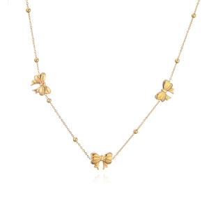 Elegant gold necklace with three bow pendants and small beads on a white background