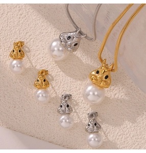 Detailed set of rabbit-shaped necklaces and earrings in gold and silver with white pearls
