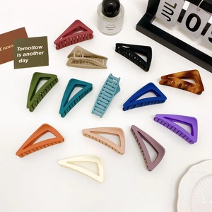 Set of 12 matte triangular hair claws in Morandi colors and amber patterns on white
