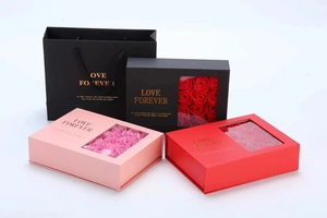 Macro view of gift box set with 12 soap roses and Love Forever gold lettering