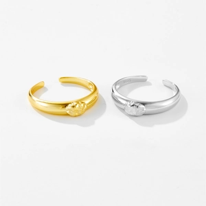 Detail of adjustable S925 sterling silver rings with irregular molten gold texture