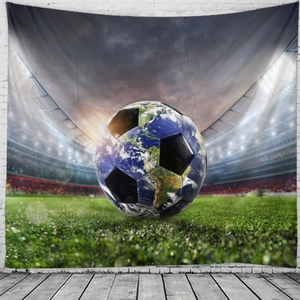 Detail of football tapestry with soccer ball and earth design on stadium background