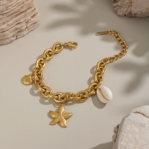 Detail of gold seashell starfish bracelet with lobster clasp and adjustable chain