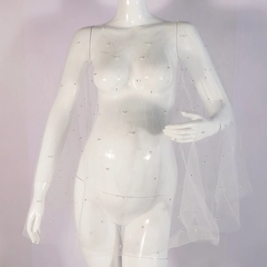 Detail view of a white maternity photography veil with delicate pearls on sheer tulle