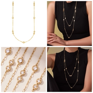 Close-up and lifestyle view of a luxury double-layer long gold necklace with 5A zircons
