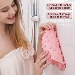 Pink silicone bath massage mat with strong suction cups for wall-mounted storage
