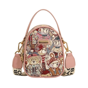 Chic teddy bear print crossbody bag with pink leather trim and wide BAB letter strap