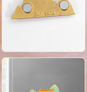 Detailed macro view of the metal fridge magnet back with dual magnets and gold finish