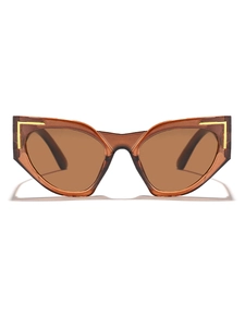 Close-up of translucent brown cat eye sunglasses with gold L-shaped metal accents