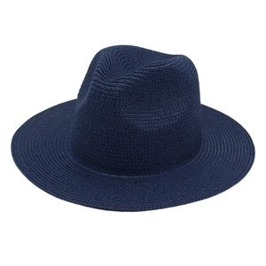 Detailed view of dark blue Panama fedora hat featuring fine woven texture and indented crown