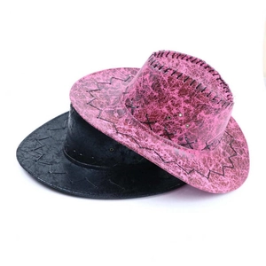 Detail of distressed texture and stitching on rose red and black Western cowboy hats