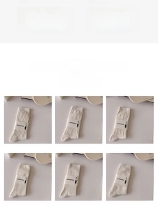 Detailed close-up of cream-colored mid-calf socks with various knit textures and packaging