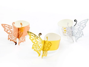 Detail of laser-cut butterfly paper napkin rings in gold, rose gold and silver finishes